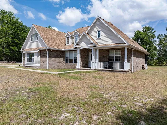 a front view of a house with yard
