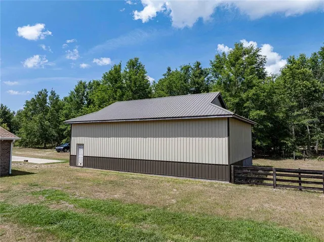 a house with trees in the background