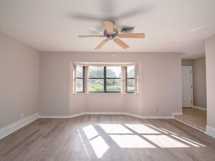 124 Hinchman Avenue Sebastian, FL 32958 - Photo 14 of 31 wooden floor in an empty room with a window
