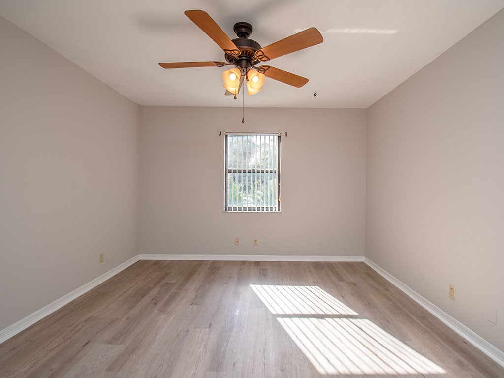 124 Hinchman Avenue Sebastian, FL 32958 - Photo 18 of 31 wooden floor in an empty room with a window
