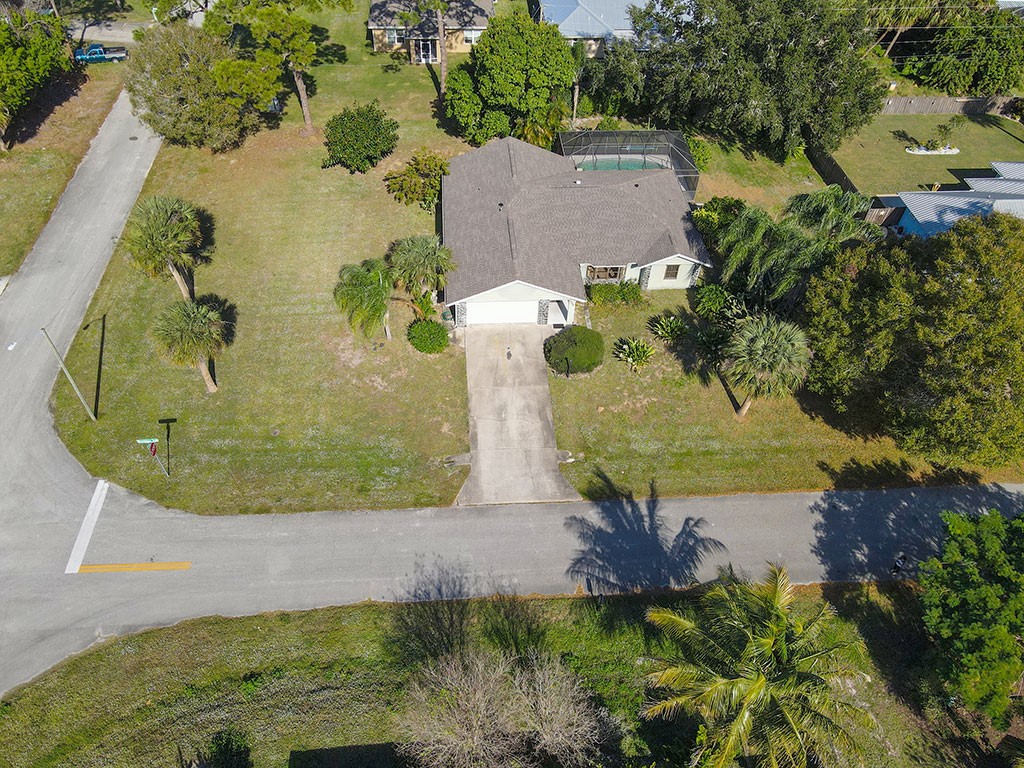 124 Hinchman Avenue Sebastian, FL 32958 - Photo 29 of 31 an aerial view of a house with a yard
