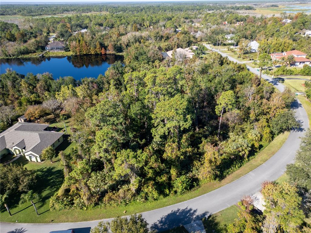 3827 Rambling Acres Drive Titusville, FL 32796 - Photo 4 of 8 an aerial view of residential houses with outdoor space