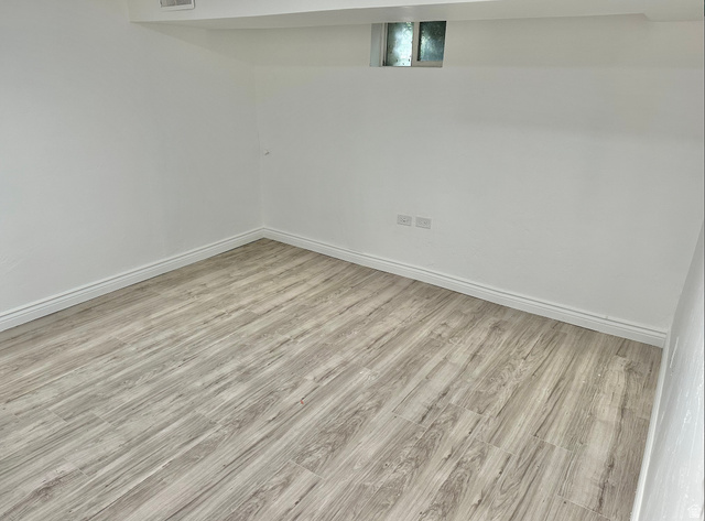 1050 West 100 North Provo, UT 84601 - Photo 10 of 16 Room featuring light wood-finish flooring, crisp white walls, and a recessed window