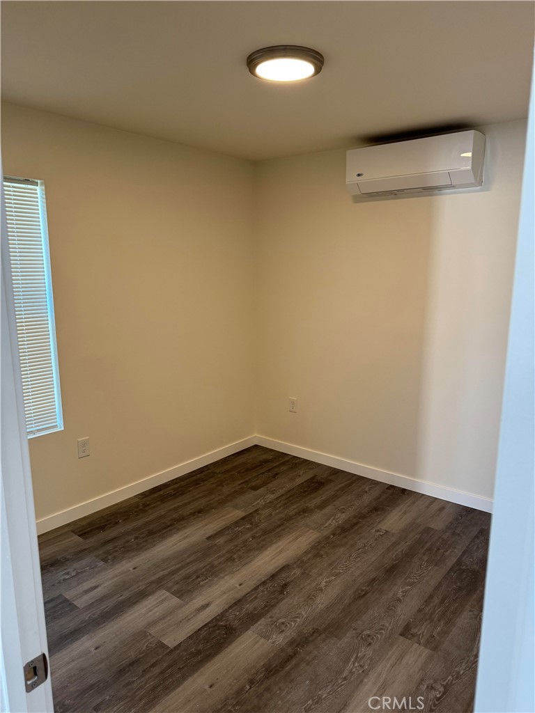 1702 Kippy Drive Colton, CA 92324 - Photo 19 of 24 a view of room with wooden floor
