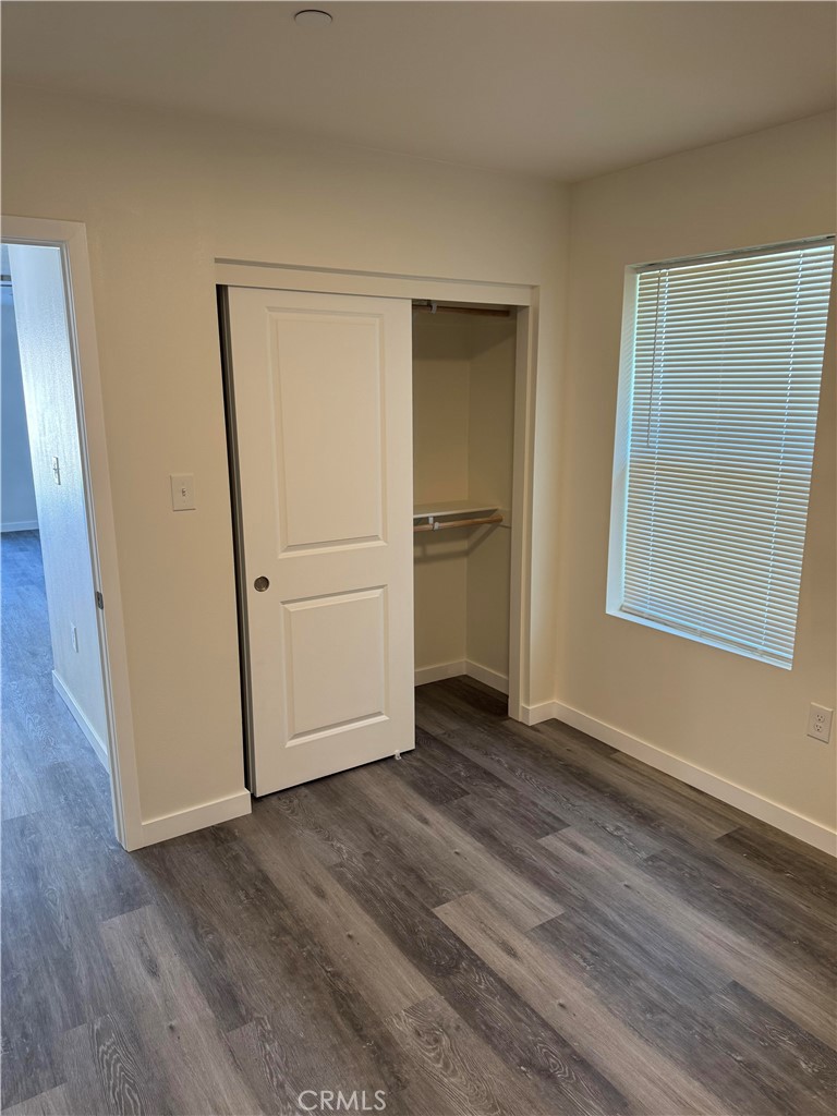 1702 Kippy Drive Colton, CA 92324 - Photo 20 of 24 a view of empty room with wooden floor