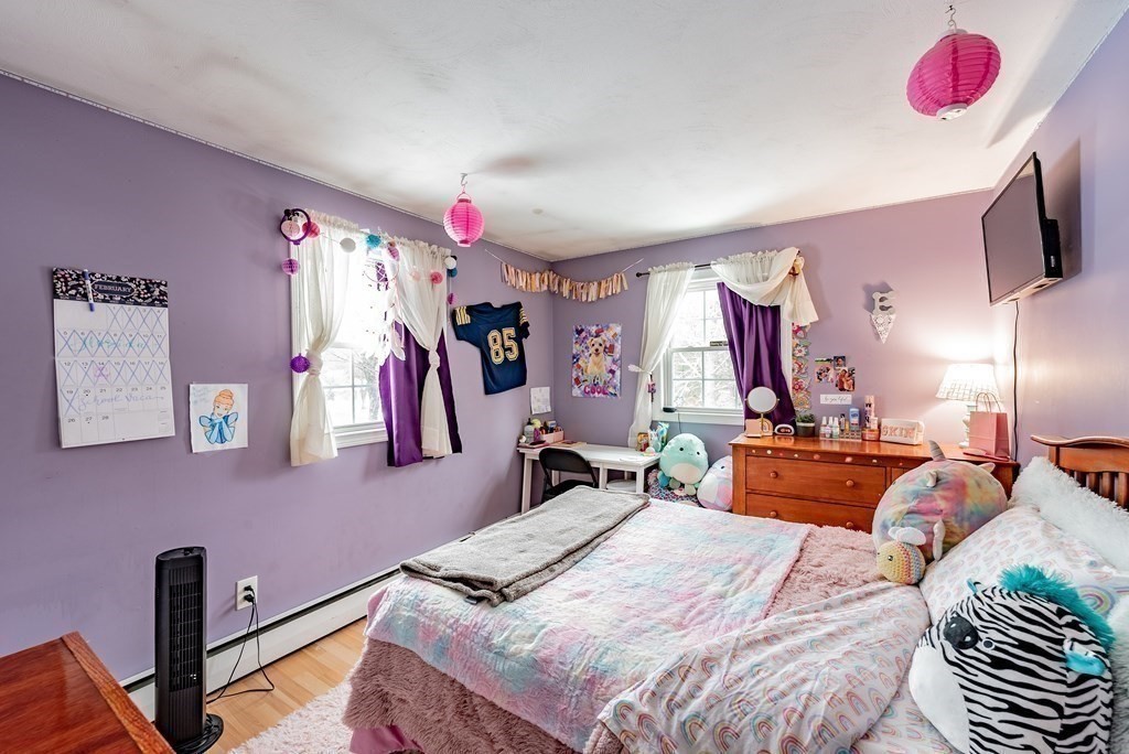 372 Ryan Road Northampton, MA 01062 - Photo 35 of 37 a bedroom with a bed dresser and a flat tv screen
