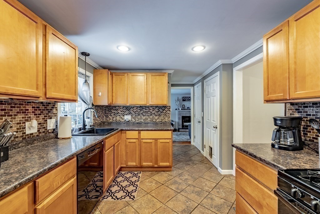 372 Ryan Road Northampton, MA 01062 - Photo 8 of 37 a kitchen with stainless steel appliances granite countertop a sink stove and refrigerator