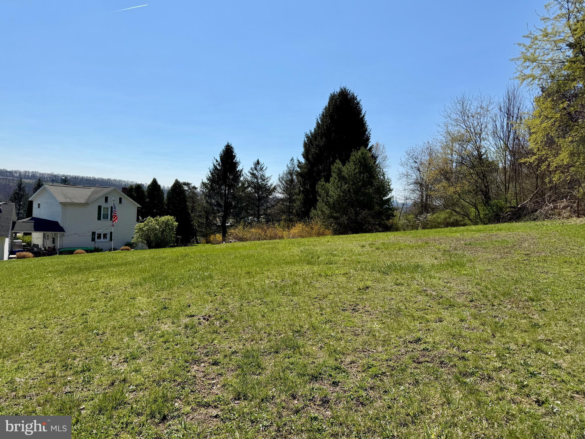 Lot 67 Ridgewood Drive New Paris, PA 15554 - Photo 4 of 9 a view of a field of grass and trees