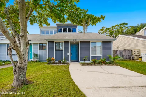 front view of a house with a yard