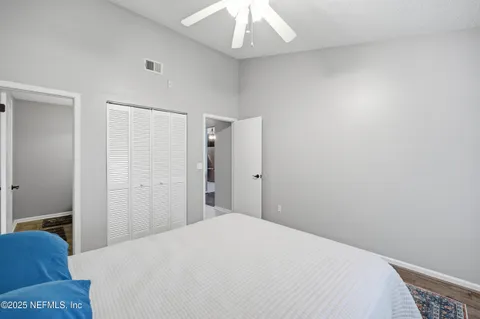 a bedroom with a bed and a hallway