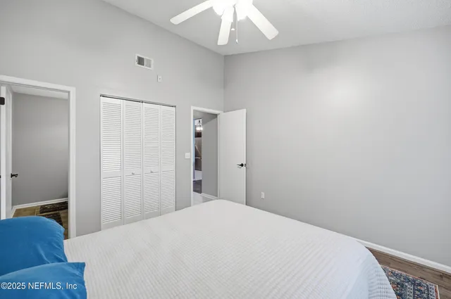 a bedroom with a bed and a hallway