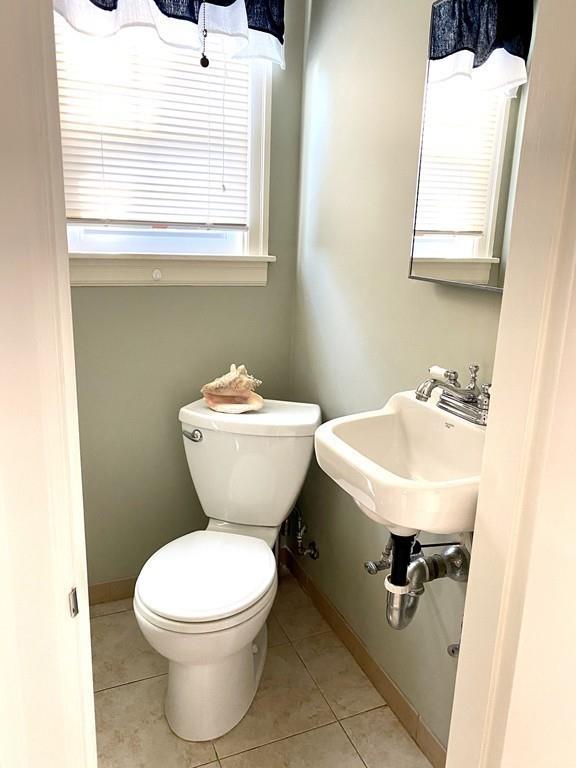 271 Gillette Avenue Springfield, MA 01118 - Photo 18 of 33 a bathroom with a toilet sink and mirror
