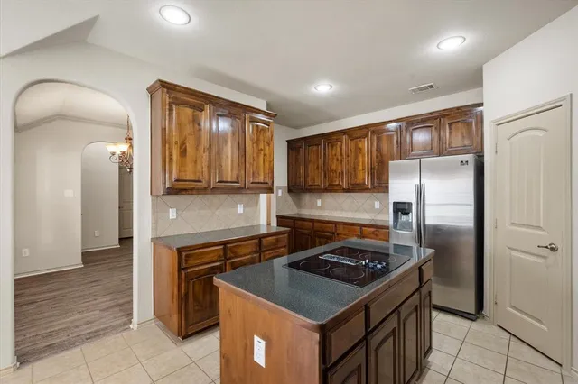 a view of an empty room with a ceiling fan