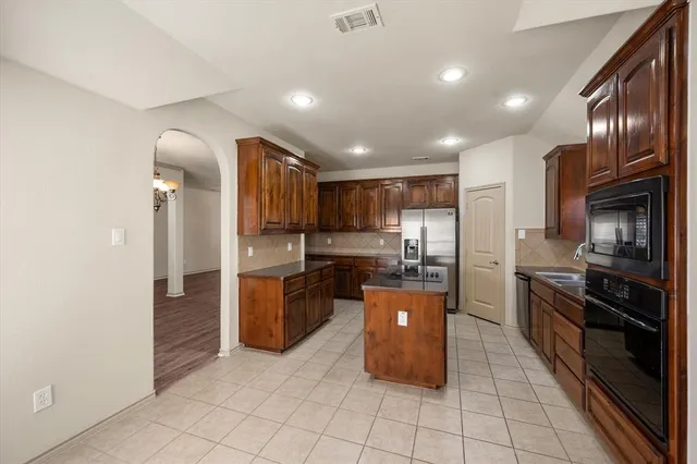 a spacious bathroom with a bathtub and a shower