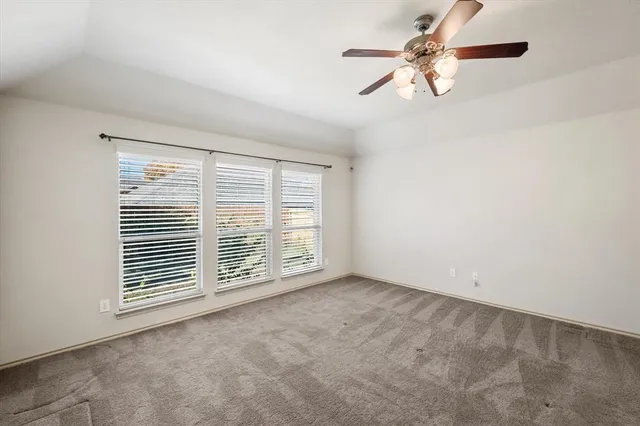 a bathroom with a tub a double vanity sink and mirror