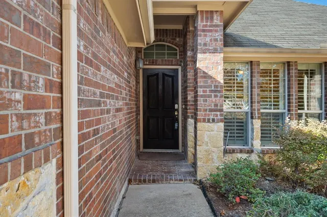 a front view of a house with a glass door