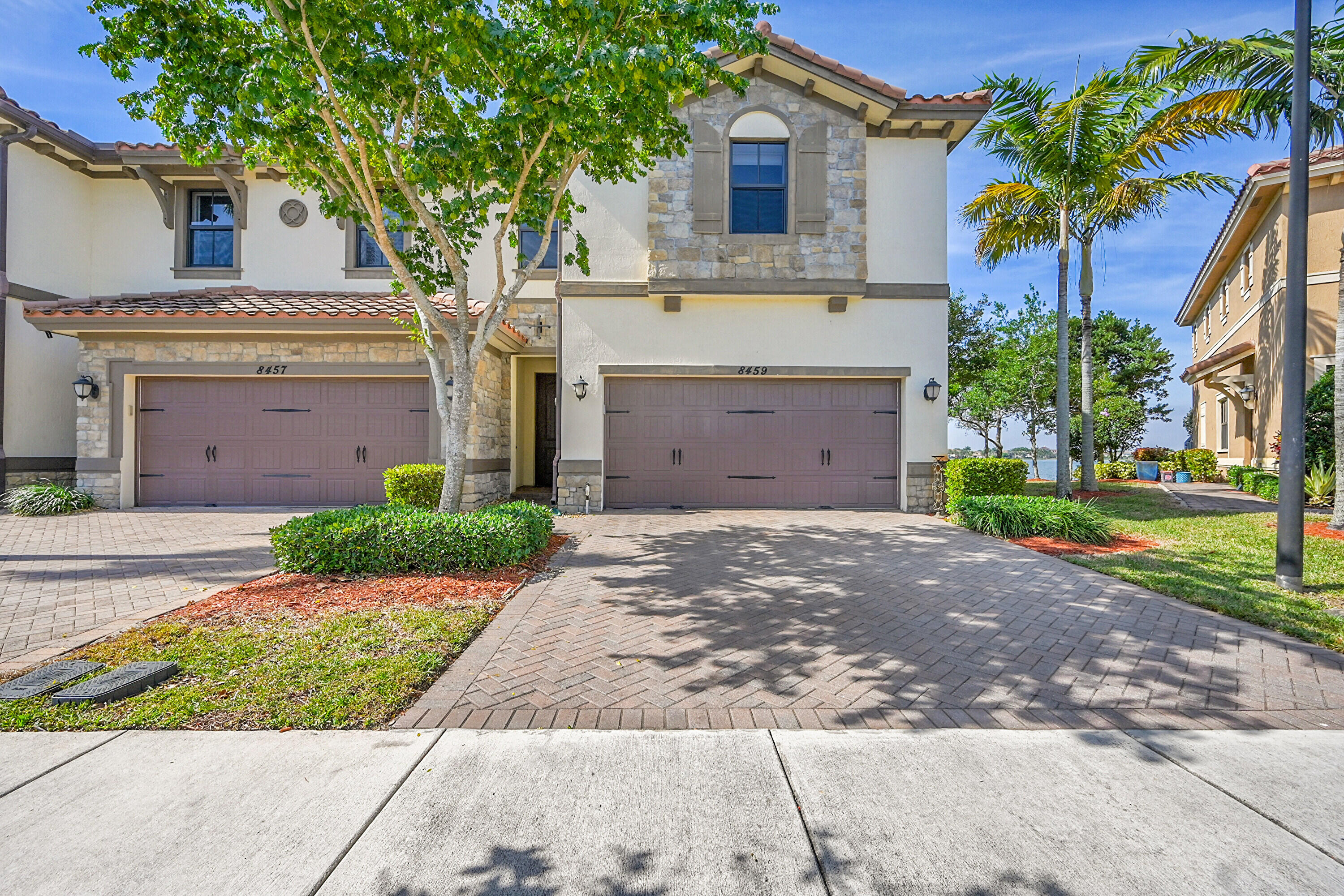 a front view of a house with a garden