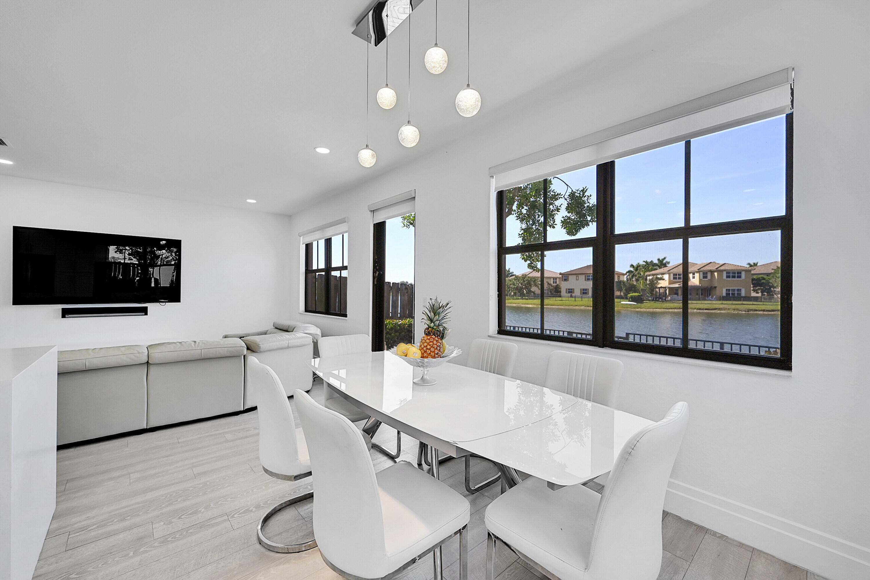 8459 Lakeview Trail Parkland, FL 33076 - Photo 14 of 55 a view of a dining room with furniture window and wooden floor
