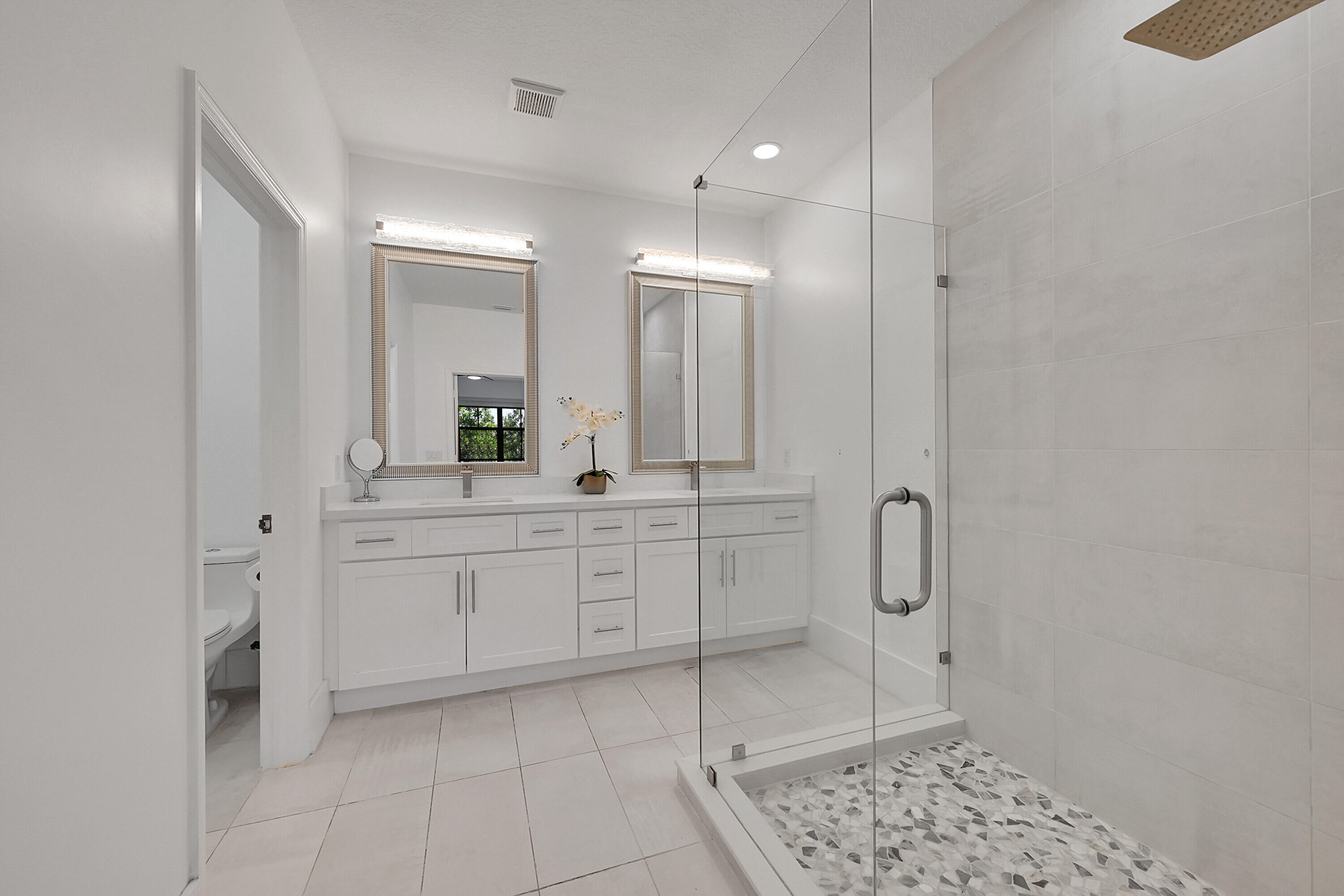 8459 Lakeview Trail Parkland, FL 33076 - Photo 25 of 55 a bathroom with a sink a toilet and a mirror