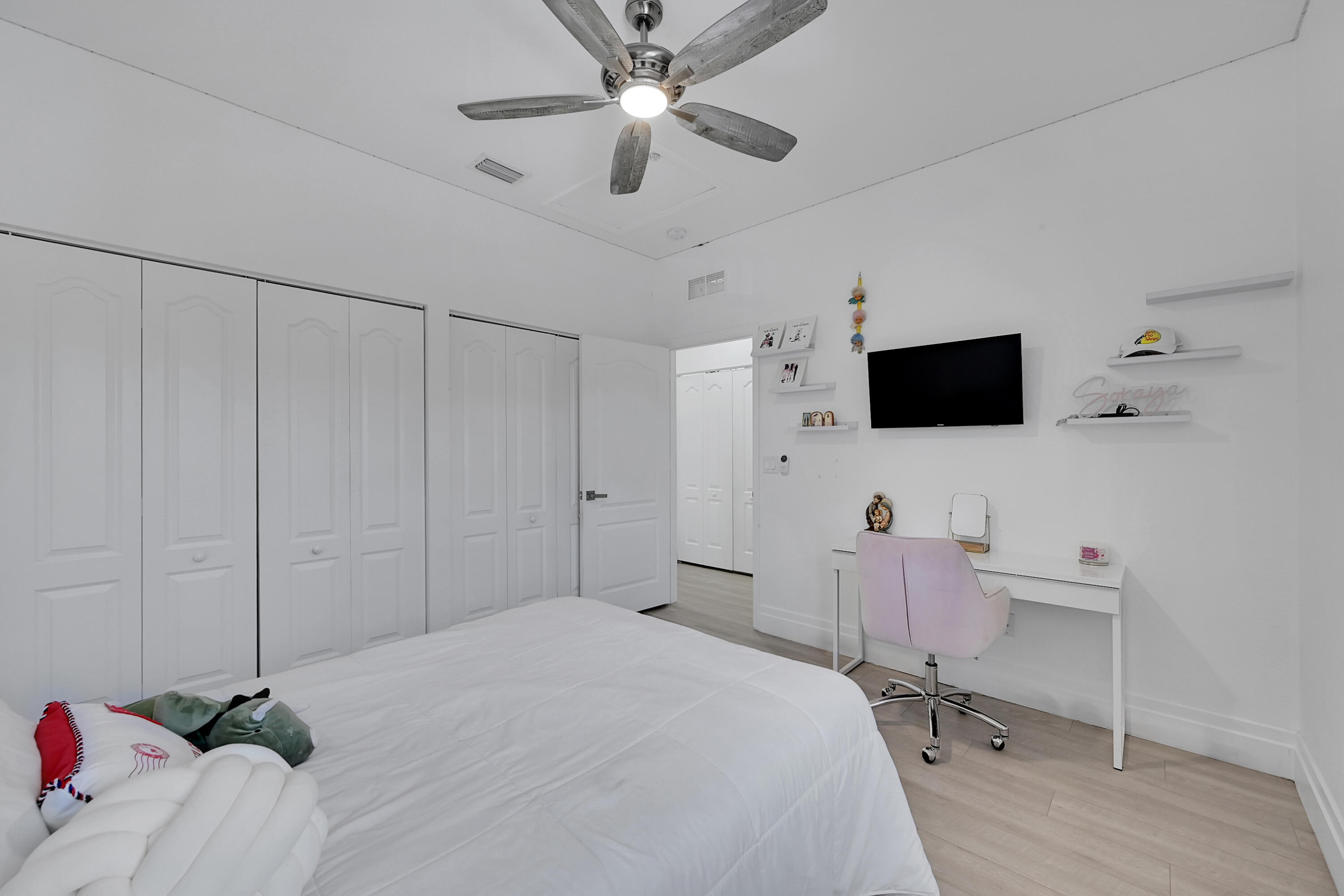 8459 Lakeview Trail Parkland, FL 33076 - Photo 31 of 55 a bedroom with a bed and a flat screen tv