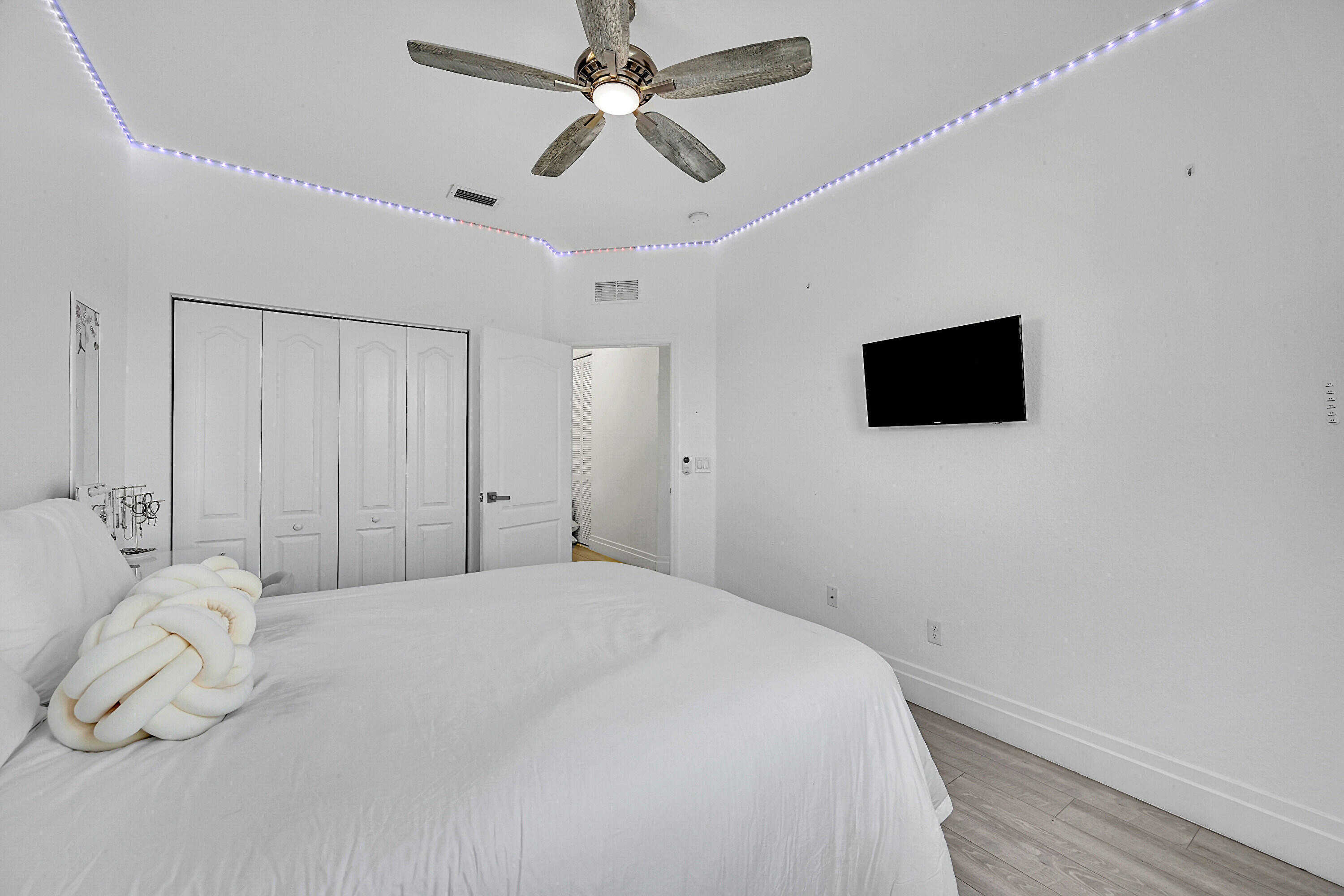 8459 Lakeview Trail Parkland, FL 33076 - Photo 35 of 55 a bedroom with a bed and a flat screen tv