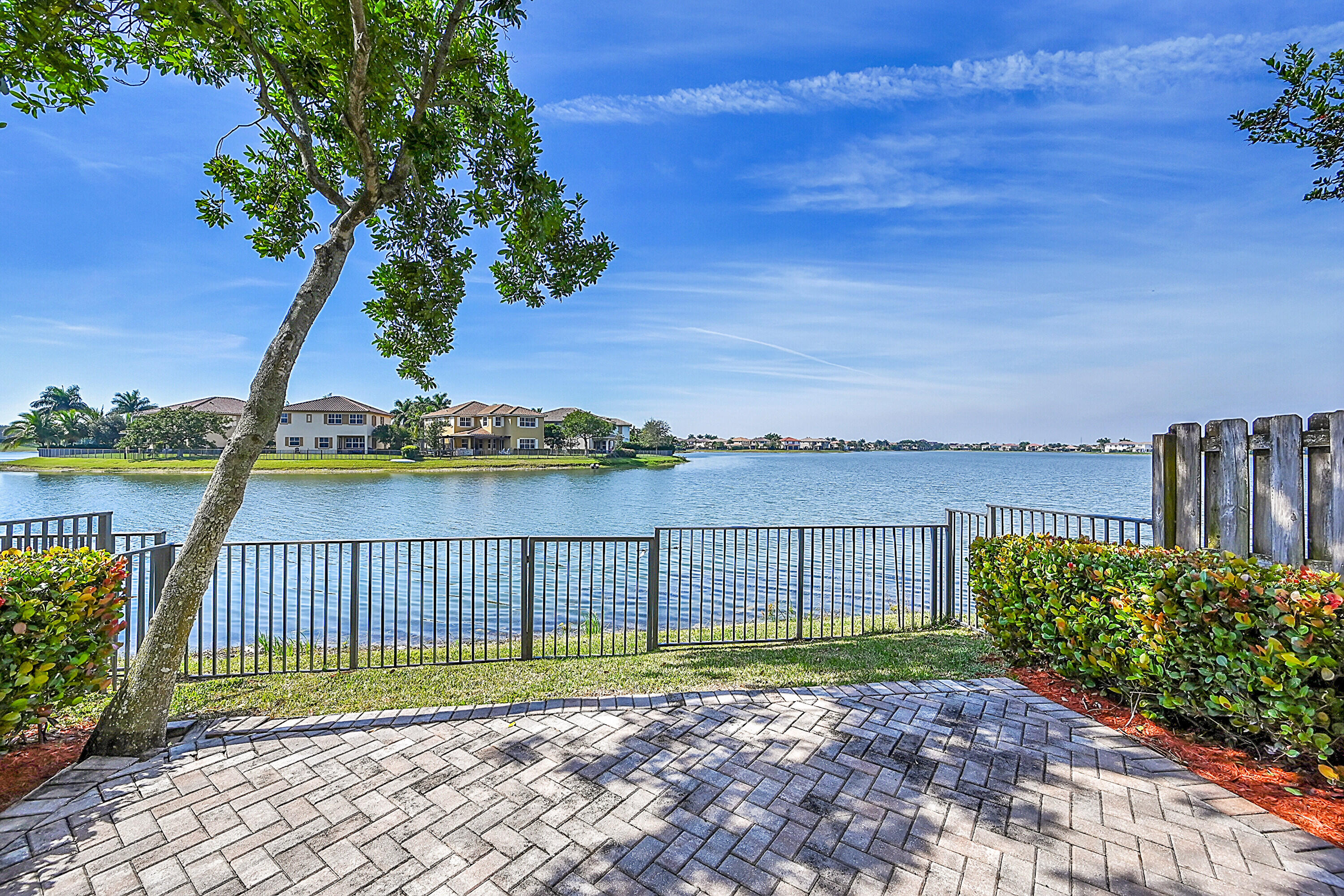 8459 Lakeview Trail Parkland, FL 33076 - Photo 36 of 55 a view of a house with a backyard and a patio