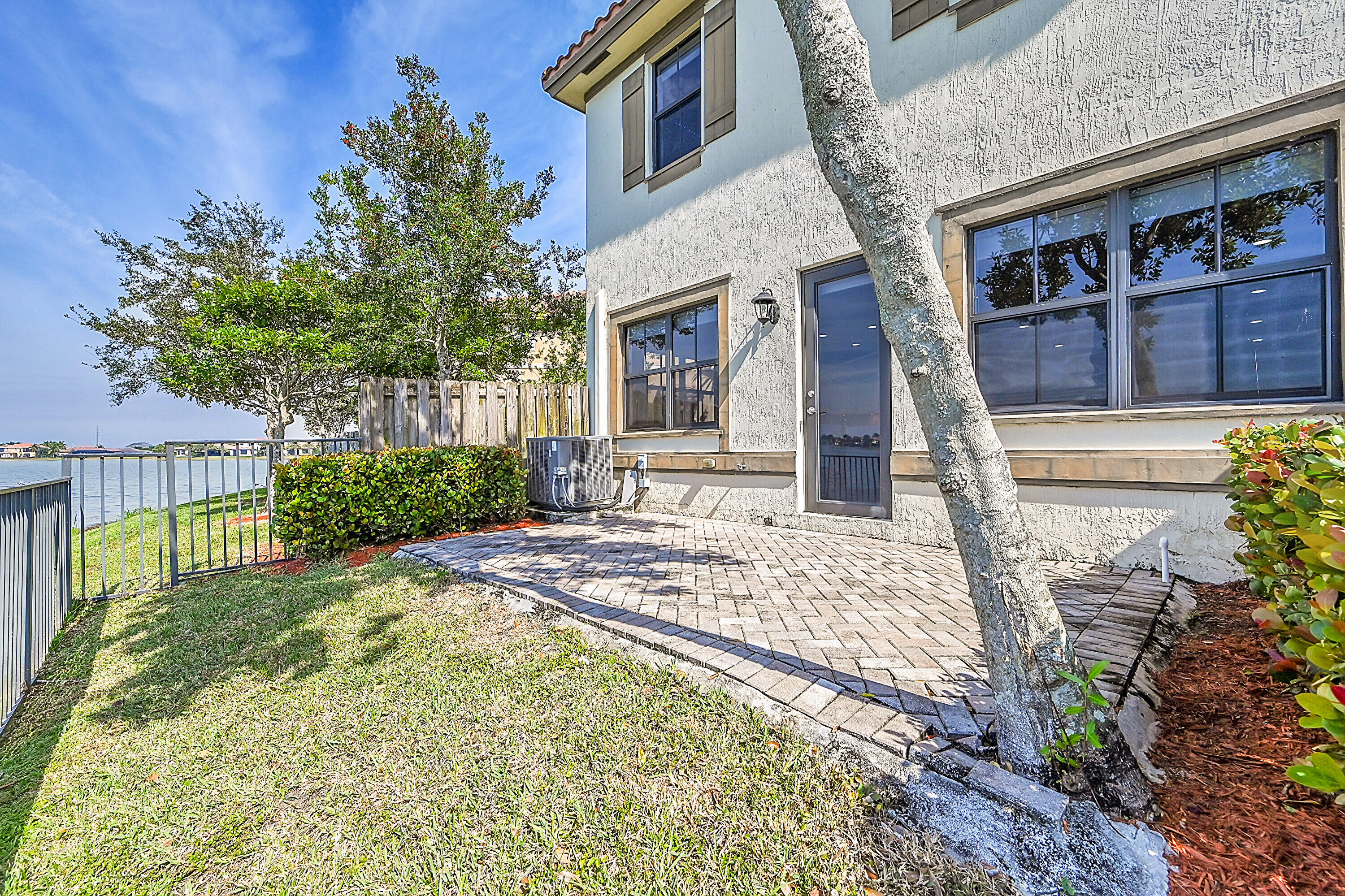 8459 Lakeview Trail Parkland, FL 33076 - Photo 39 of 55 a front view of a house with garden