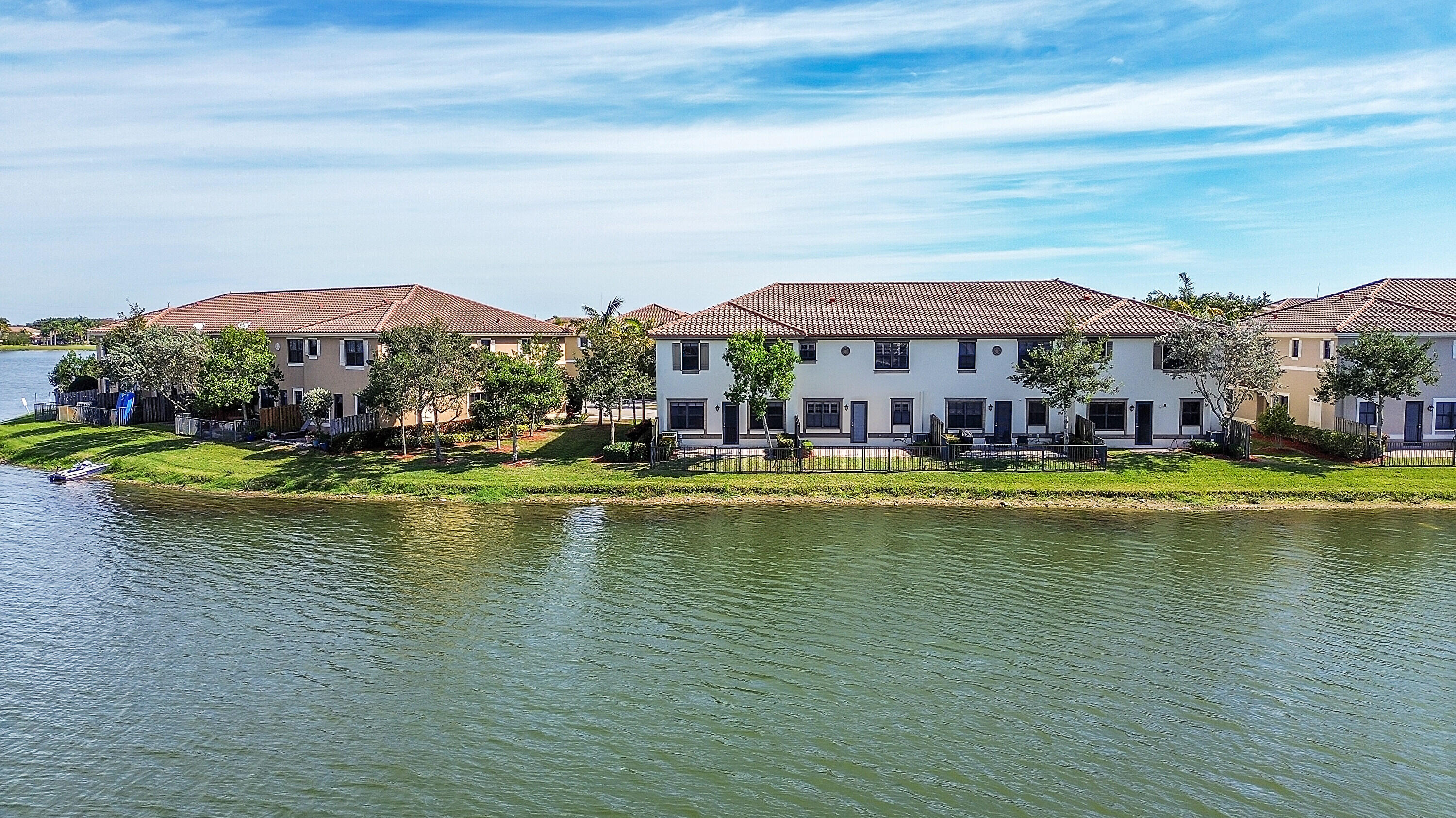 8459 Lakeview Trail Parkland, FL 33076 - Photo 44 of 55 a view of a swimming pool with lounge chair
