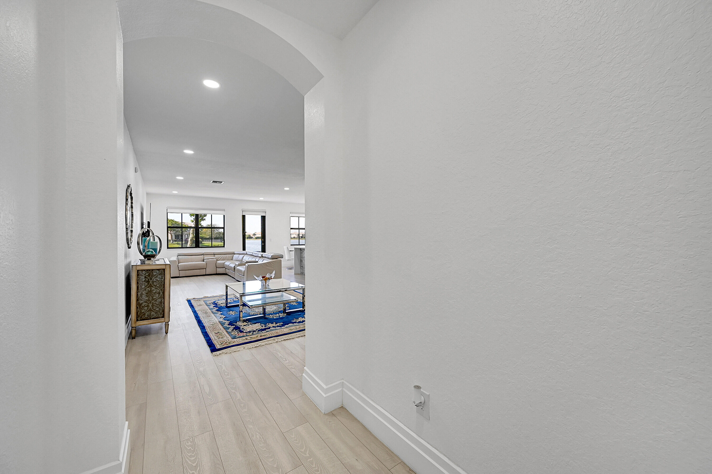 8459 Lakeview Trail Parkland, FL 33076 - Photo 6 of 55 a living room with furniture and a wooden floor