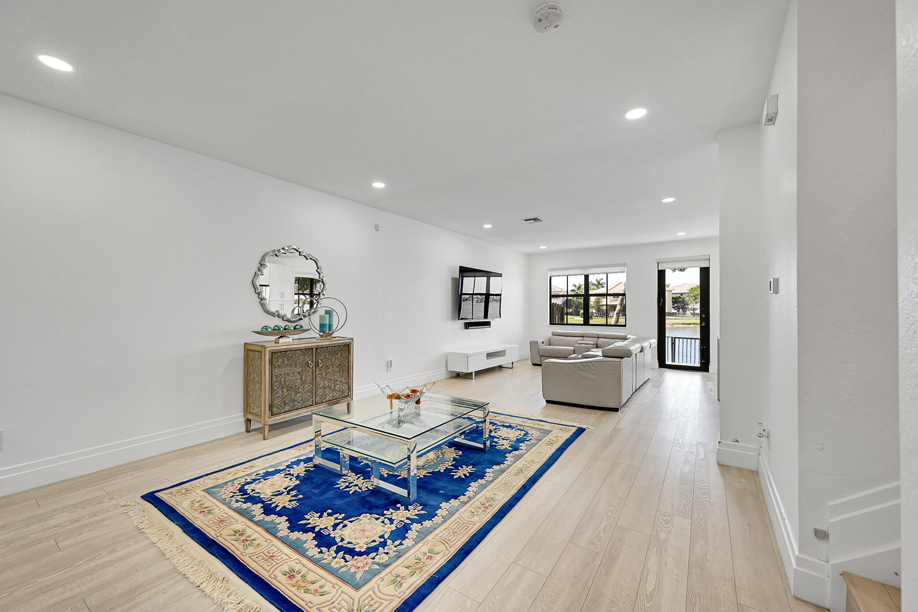 8459 Lakeview Trail Parkland, FL 33076 - Photo 8 of 55 a living room with furniture and a rug
