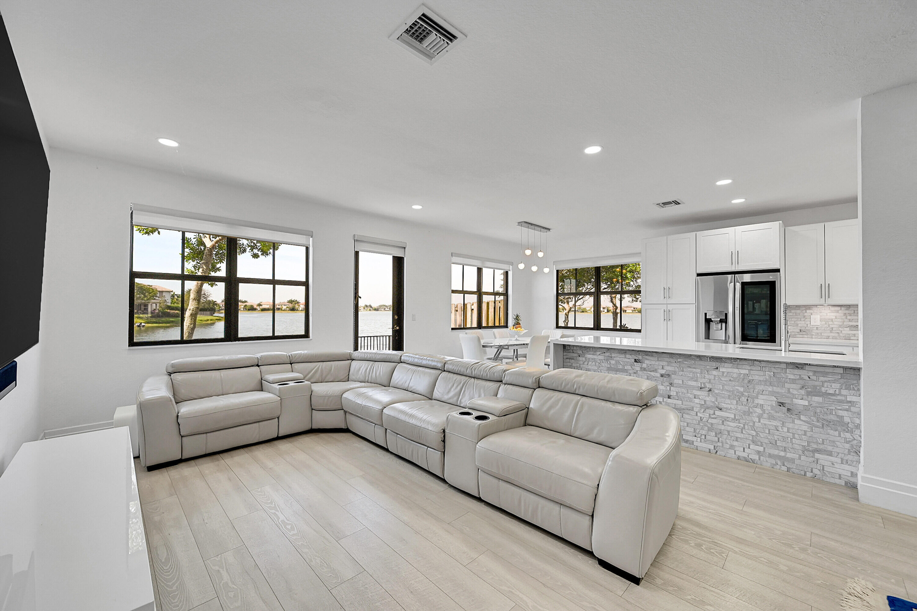 8459 Lakeview Trail Parkland, FL 33076 - Photo 10 of 55 a living room with furniture and a flat screen tv