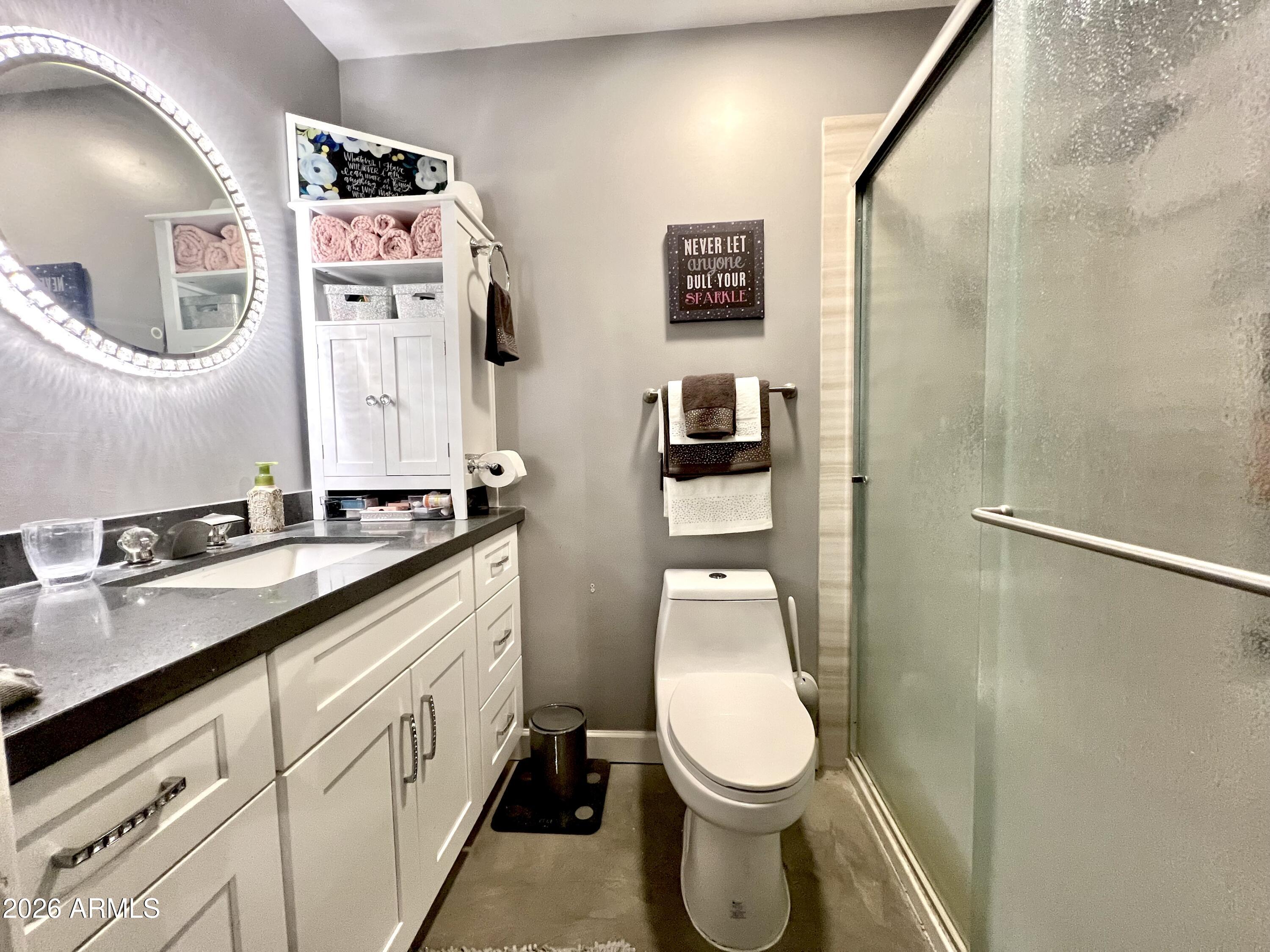 3425 East Libby Street Phoenix, AZ 85032 - Photo 11 of 16 a bathroom with a toilet sink vanity granite and shower
