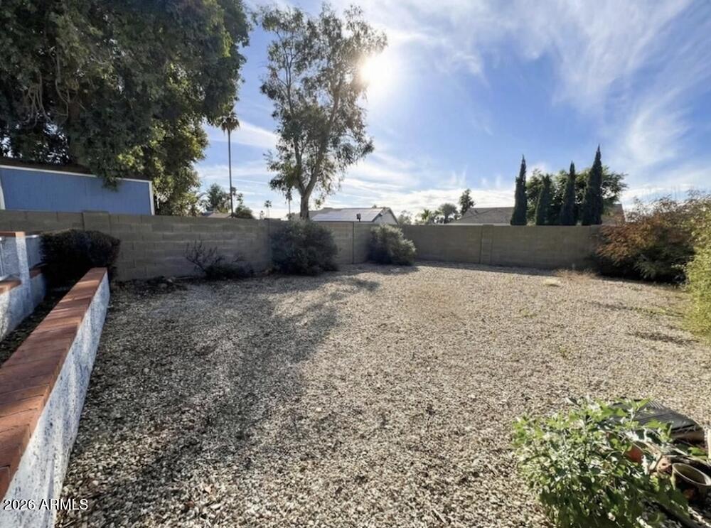 3425 East Libby Street Phoenix, AZ 85032 - Photo 15 of 16 a view of swimming pool with a yard