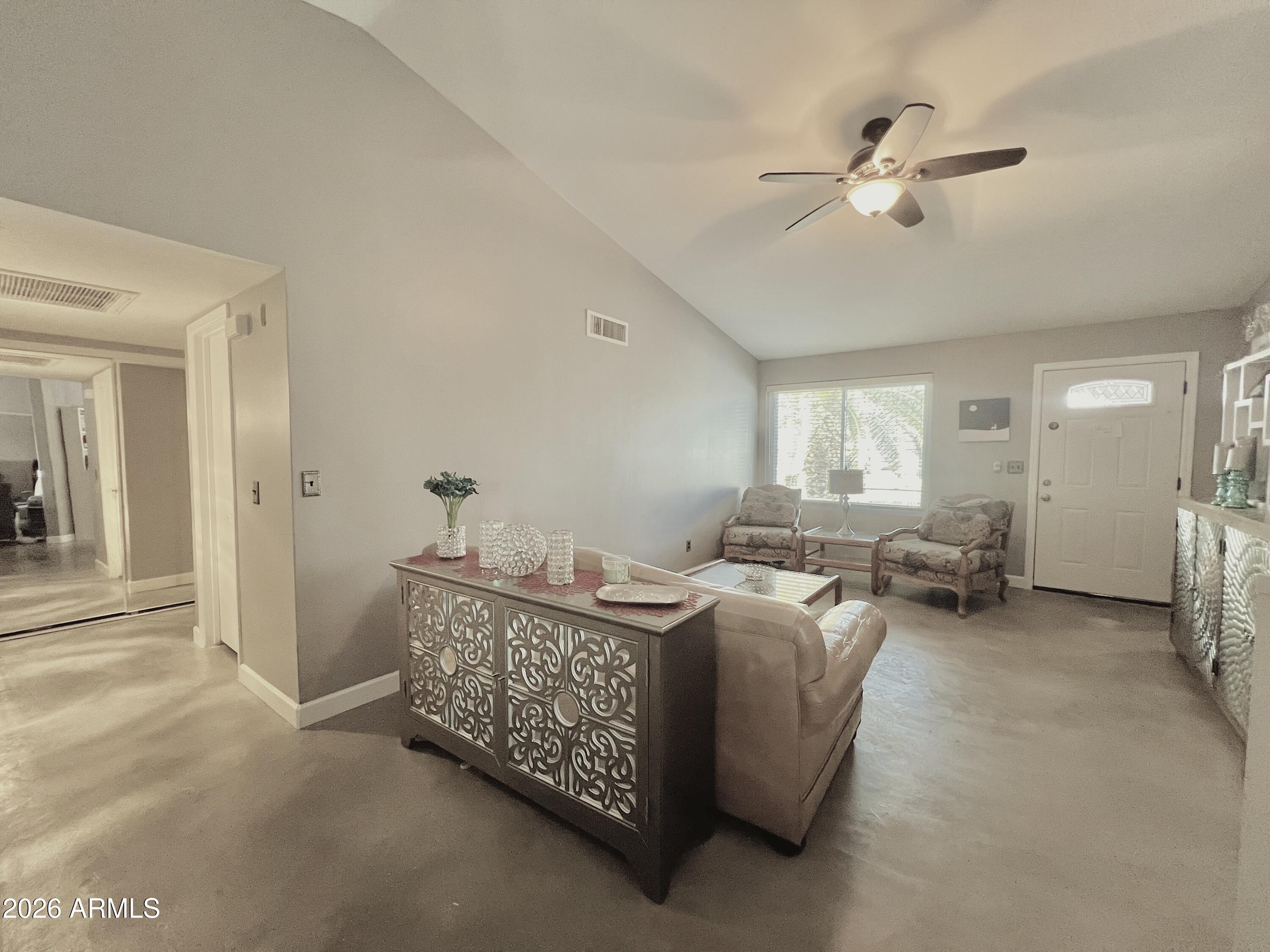 3425 East Libby Street Phoenix, AZ 85032 - Photo 4 of 16 a living room with furniture and a chandelier