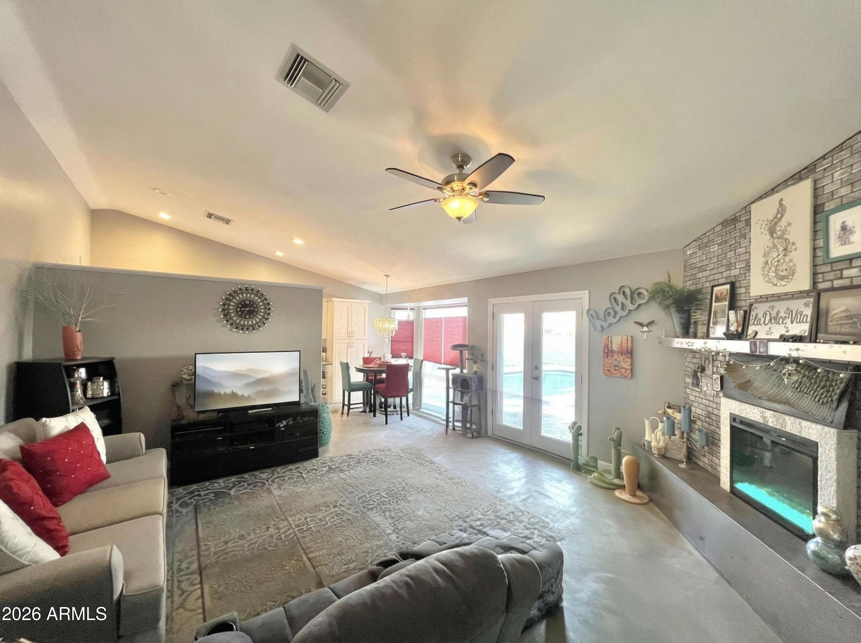 3425 East Libby Street Phoenix, AZ 85032 - Photo 6 of 16 a living room with furniture and a fireplace