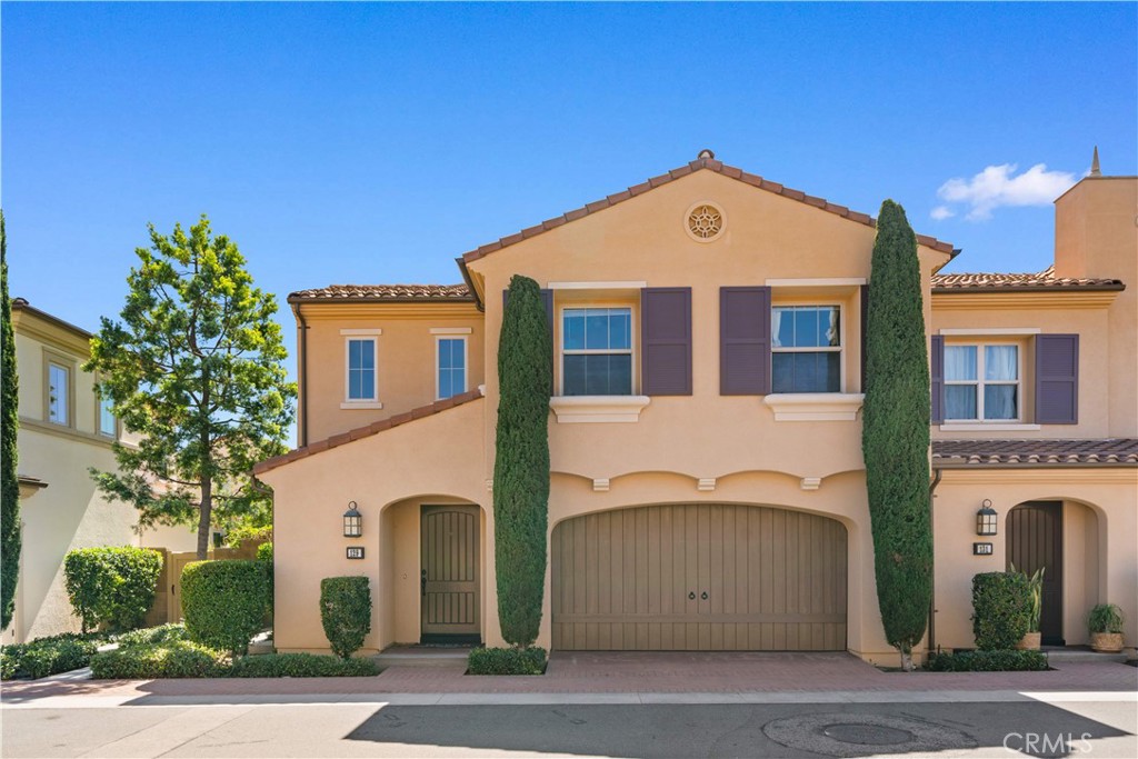 129 Overbrook Irvine, CA 92620 - Photo 1 of 41 a front view of a house with a yard