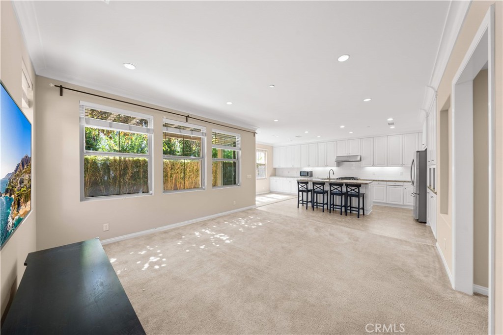 129 Overbrook Irvine, CA 92620 - Photo 11 of 41 a view of an empty room with windows & chairs