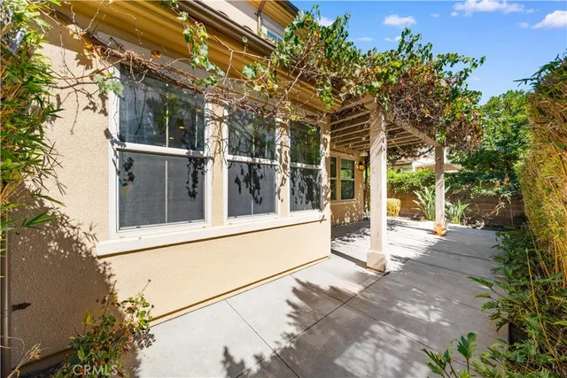 a view of a house with a large tree