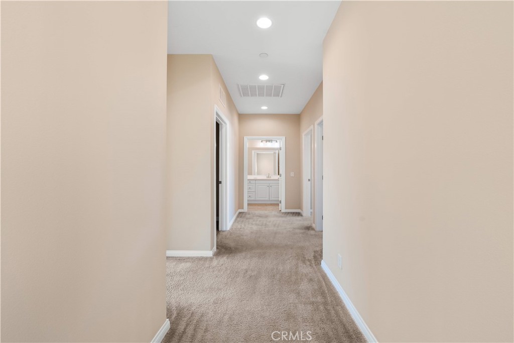 129 Overbrook Irvine, CA 92620 - Photo 25 of 41 a view of a hallway with wooden floor