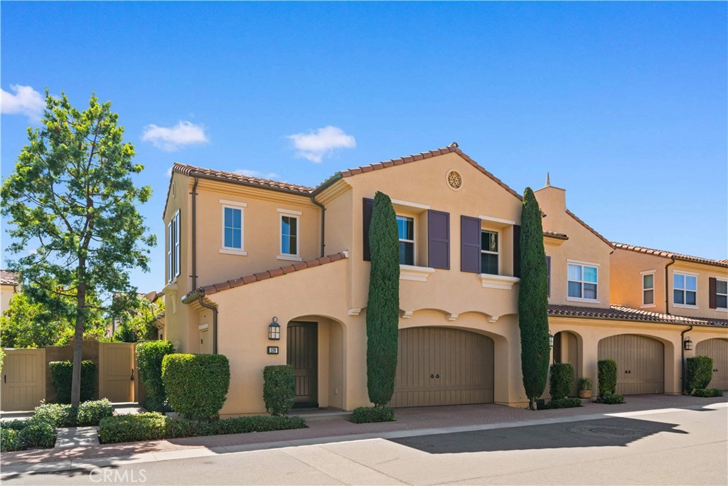 129 Overbrook Irvine, CA 92620 - Photo 3 of 41 a front view of a house with a garden