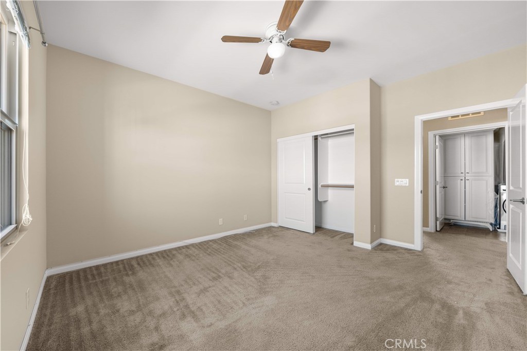 129 Overbrook Irvine, CA 92620 - Photo 35 of 41 a view of an empty room with a ceiling fan