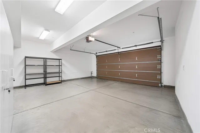 a view of an empty room with a cabinet