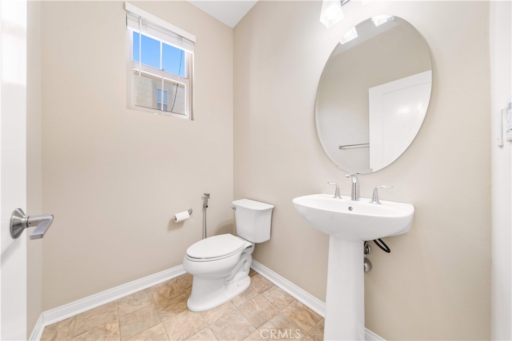 129 Overbrook Irvine, CA 92620 - Photo 8 of 41 a bathroom with a toilet sink and mirror