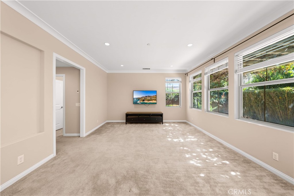 129 Overbrook Irvine, CA 92620 - Photo 10 of 41 a living room with furniture and a large window