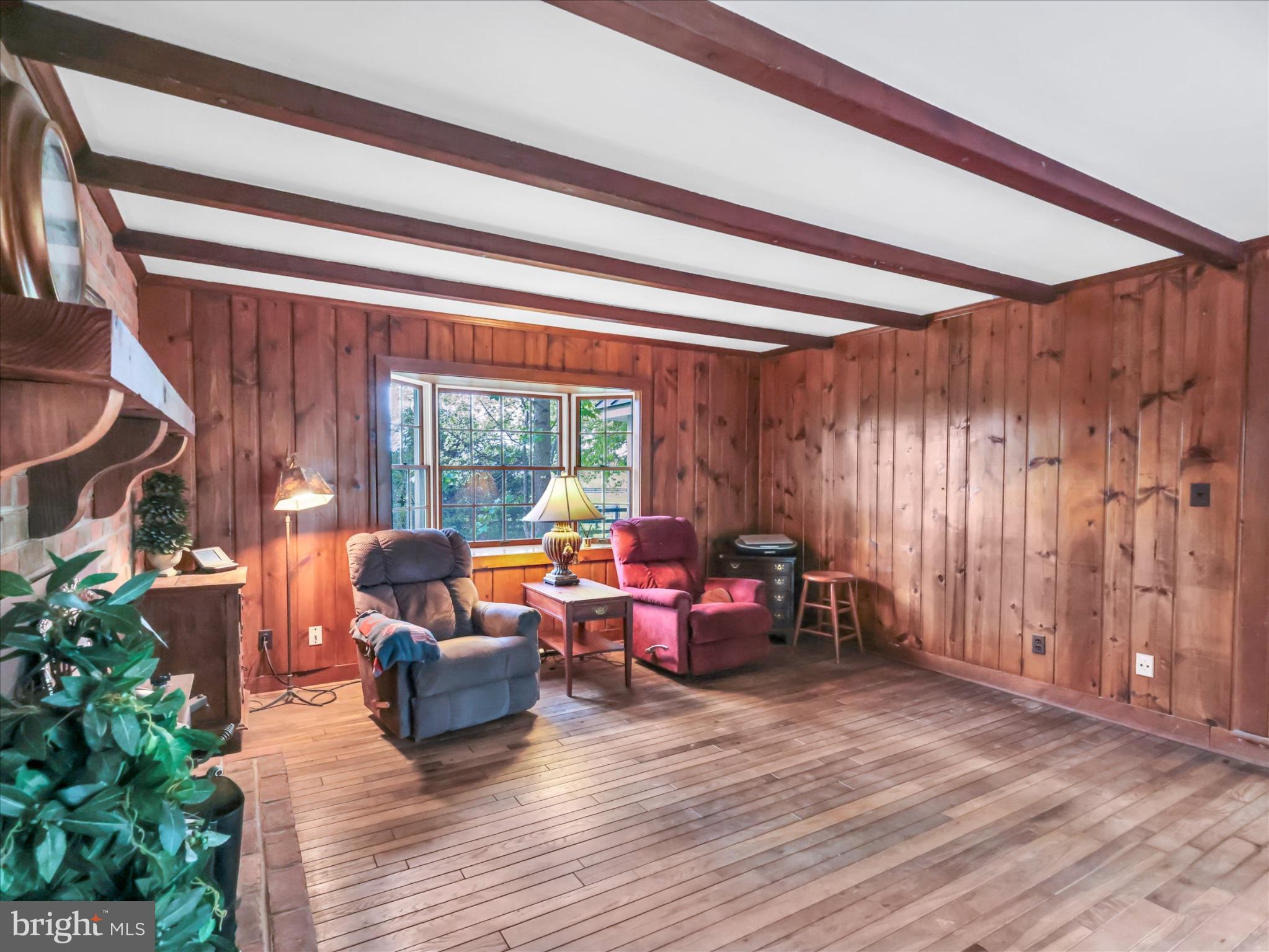 19255 Telegraph Springs Road Purcellville, VA 20132 - Photo 22 of 107 a living room with furniture and a large window