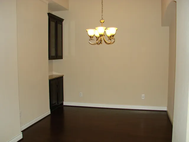 a view of a hallway with a chandelier