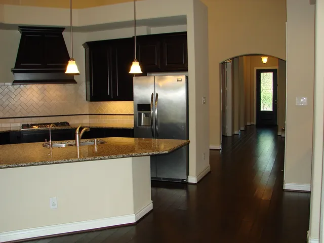 a kitchen with a sink and a refrigerator