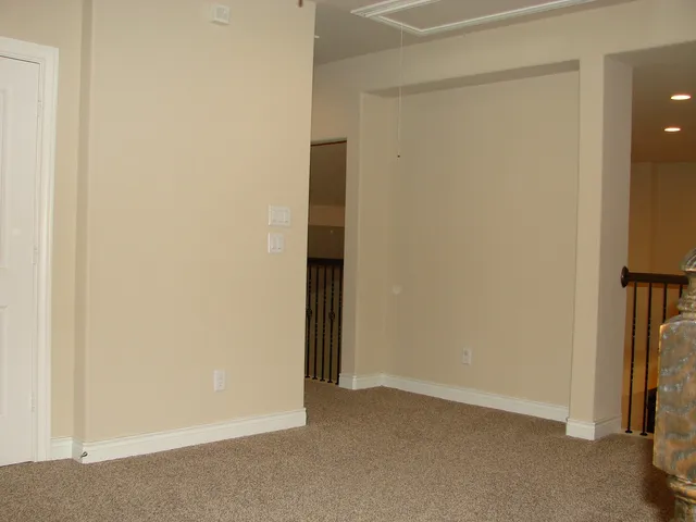 a bathroom with a bathtub shower sink mirror vanity and toilet