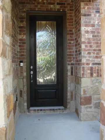 a view of front door with wooden floor