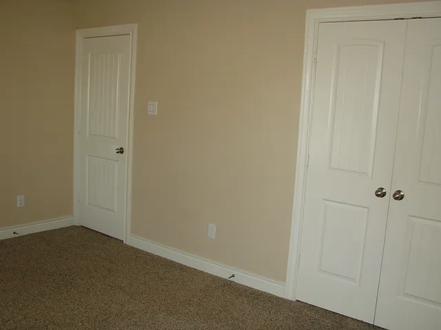 a view of a house with backyard and porch